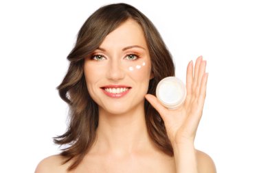 Woman applying cream clipart