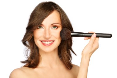 Woman applying make-up clipart