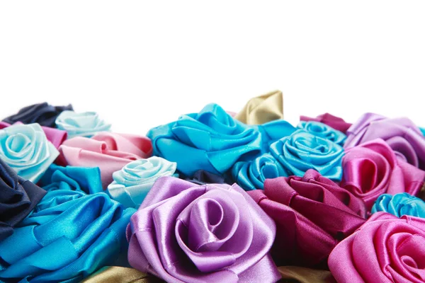 Blue, vinous, pink and turquois handmade silk roses on white background — Stock Photo, Image