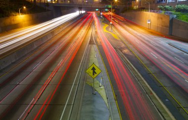 Merging Freeway traffic at night clipart