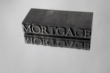Mortgage spelled with Metal Type Reflection clipart