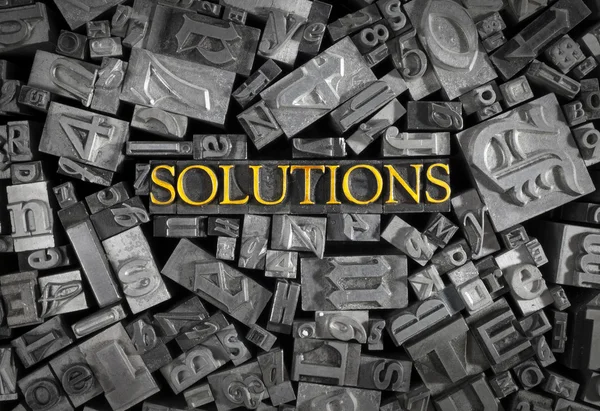 Solutions spelled out in metal letters — Stock Photo, Image