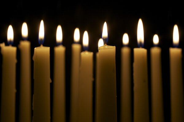 Several Candles on Black Background
