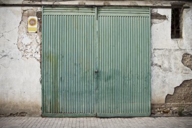 Old door in old street of shops clipart