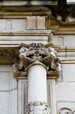 Corinthian column capital , facade of the University of Alcala de Henares, Madrid, Spain clipart