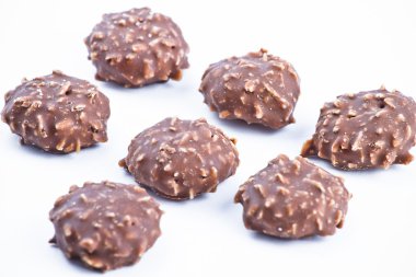 Delicious chocolate pralines over white background. clipart