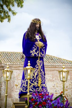 Spanish easter celebration procession of the christ of medinacel clipart