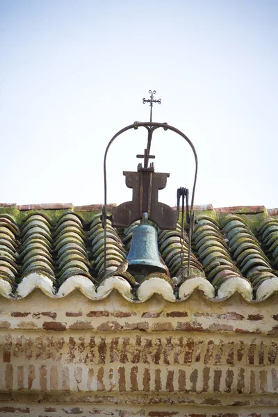 Roof tiles with brass bell — Stock Photo, Image