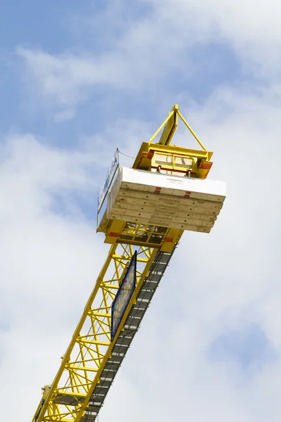 Construction crane against cloud sky — Stock Photo, Image