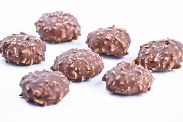 Cukierki czekoladowe w tle. — Zdjęcie stockowe