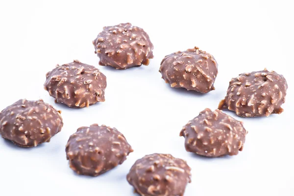 Cukierki czekoladowe w tle. — Zdjęcie stockowe