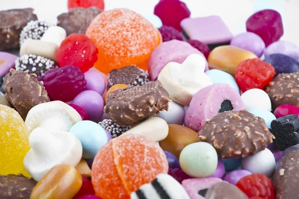 Muchos dulces sobre fondo blanco.Snacks de frutas — Foto de Stock