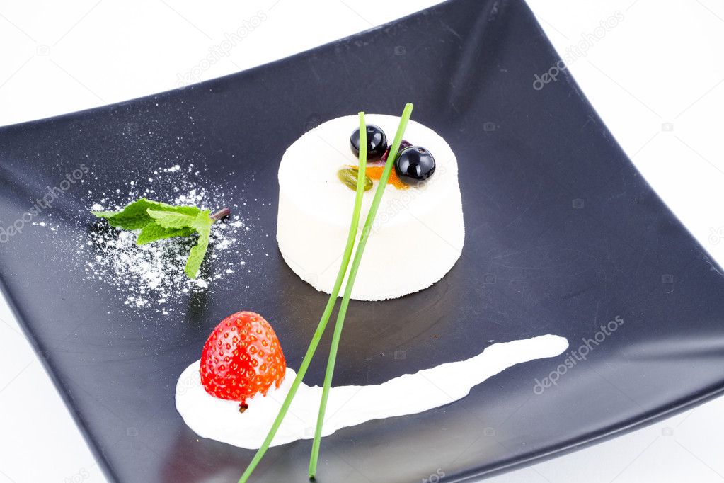 Nouvelle Cuisine Vanilla mousse dessert with cranberries on top