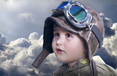 A little cute baby dreams of becoming a pilot. Pilot outfit, hat clipart