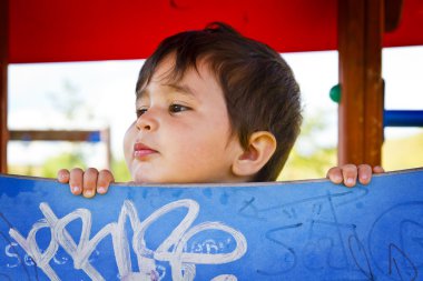 Little boy playing in the park clipart