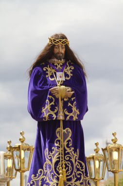 Spanish easter celebration procession of the christ of medinacel clipart