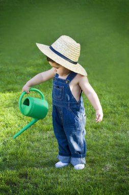 Little baby gardener lost in the moment clipart