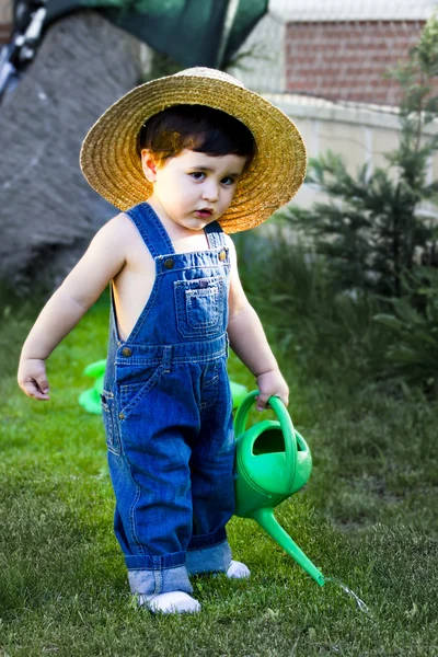 Little baby gardener concentrate in his work — Stock Photo, Image