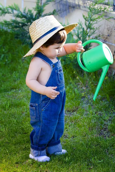 Little baby gardener testing his tools — Stock Photo, Image