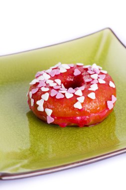 bir plaka üzerinde renkli donut