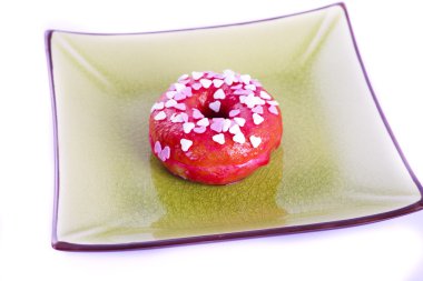 bir plaka üzerinde renkli donut