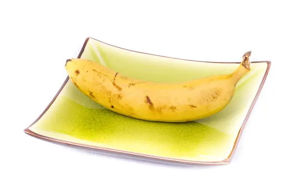 Plátano en plato colorido — Foto de Stock