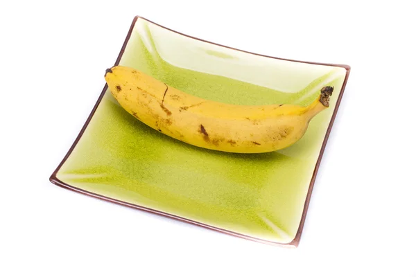 Plátano en plato colorido —  Fotos de Stock