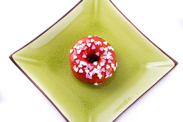 Colorful donut on a plate — Stock Photo, Image