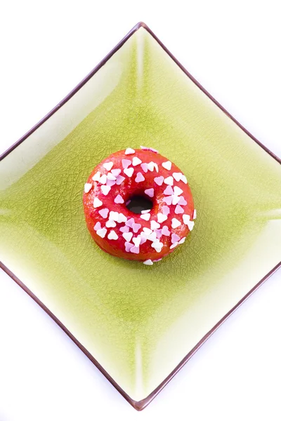 Colorful donut on a plate — Stock Photo, Image