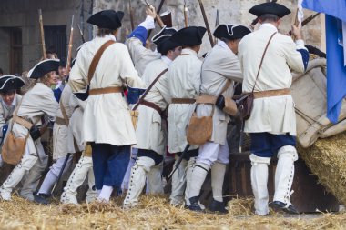 Soldier with carabiner and jacket during the re-enactment of the clipart