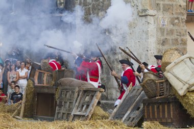 Defence and attack the castle during the re-enactment of the War clipart