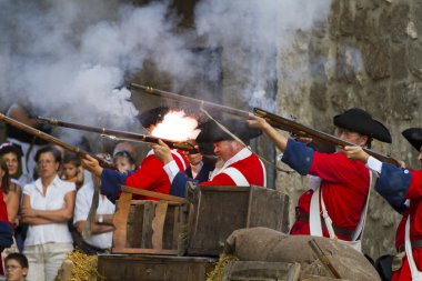 Soldiers firing during the re-enactment of the War of Succession clipart