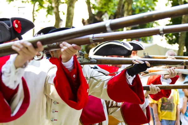 Soldiers firing during the re-enactment of the War of Succession — Stock Photo, Image