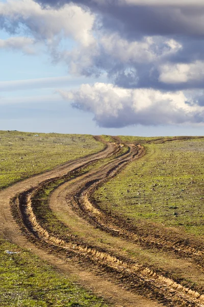 Strada di campagna con fango, solchi — Foto Stock