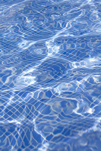 Waves on a surface of water in pool — Stock Photo, Image