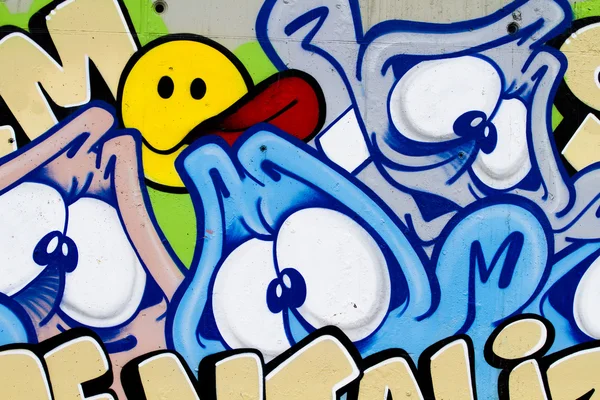 Color cartoons, segment of an urban grafitti on wall — Stock Photo, Image