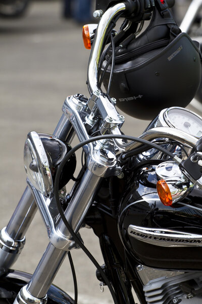 Motorbike's chromed engine. Bikes in a street