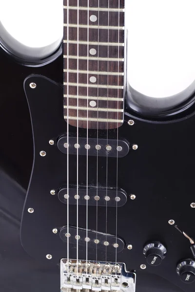 Fehér alapon fekete elektromos gitár — Stock Fotó