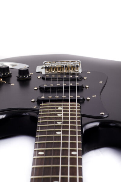 Black electric guitar on white background