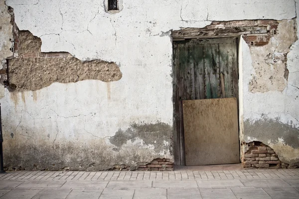 Old door in old street of shops — Stock Photo, Image