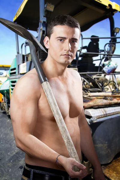 Builder on sphalting paver machine during Road street works — Stock Photo, Image