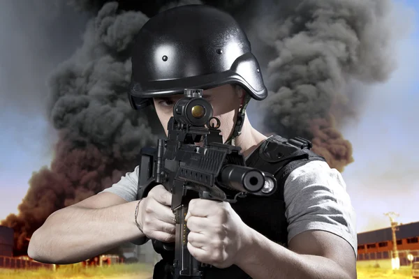 Person, explosion in an industry, armed police wearing bulletpro — Stock Photo, Image
