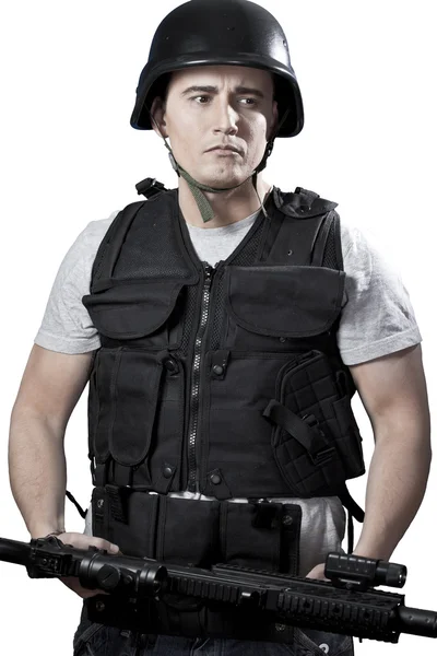 Armed police in protective cask with a gun — Stock Photo, Image