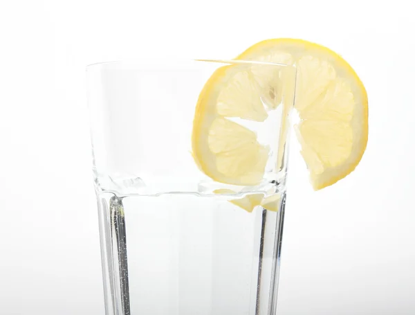 stock image A glass of mineral water with a lemon