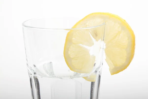 stock image A glass of mineral water with a lemon