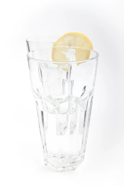 stock image A glass of mineral water with a lemon