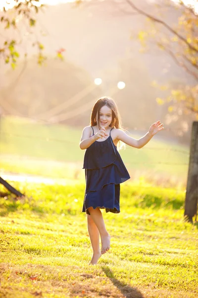 A young six year old girl outdoors — Stock Photo, Image