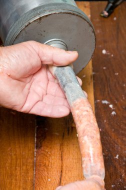 Filling a sausage clipart