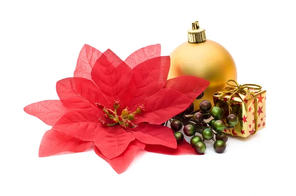 Fake poinsettia with christmas ornaments — Stock Photo, Image