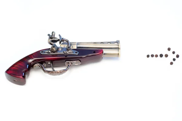 Briquet à gaz en forme de pistolet avec flèche de poivre — Photo